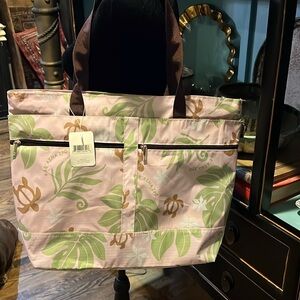 NWT nylon Travel bagfrom Hawaii. 14” tall 18” wide 5” deep with 3 zippers